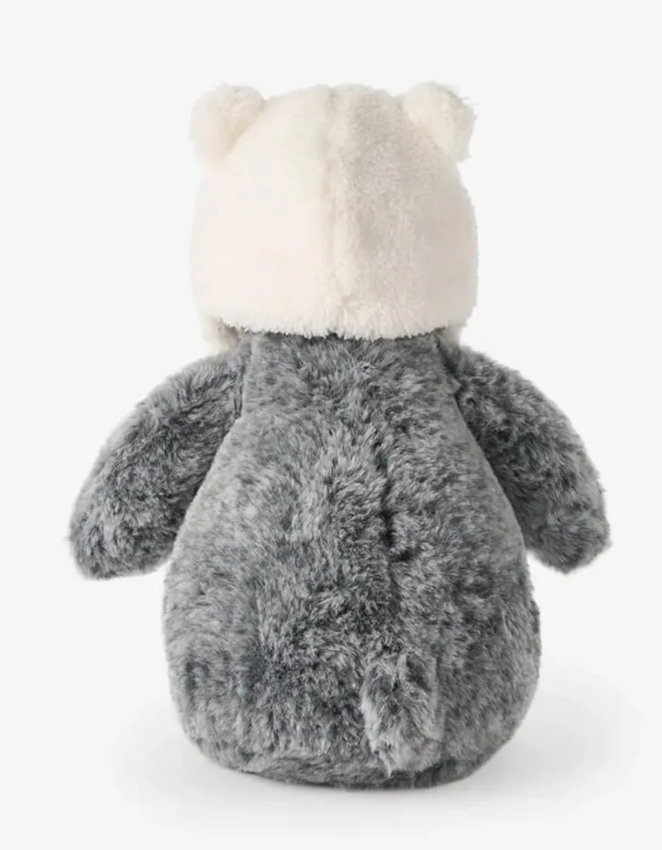 Penguin wearing a polar bear hat stuffed toy