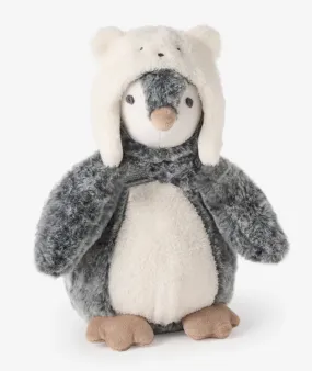 Penguin wearing a polar bear hat stuffed toy